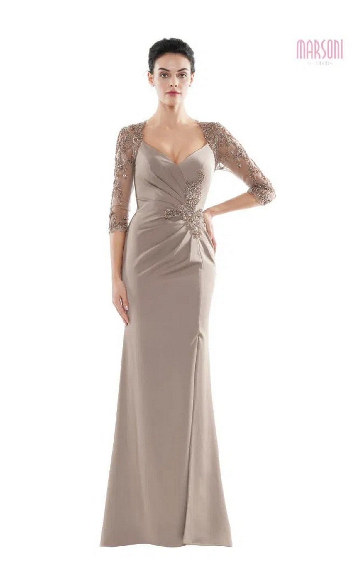 A woman wearing the Marsoni MV1070 long formal dress in taupe, featuring a fitted bodice, beaded appliques on sheer three-quarter sleeves, and floral detailing at the waist.